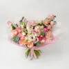 Vertimo rezultatas A bouquet of pink and cream flowers