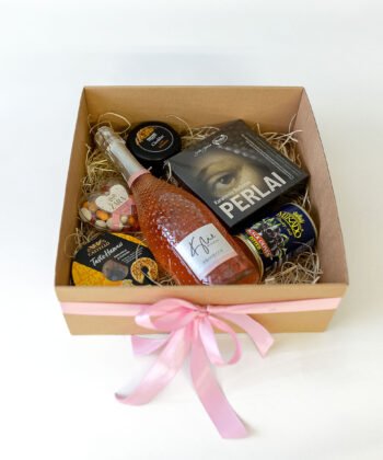 A box with sweets and the bottle of prosecco