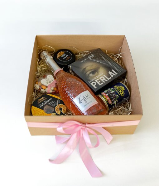 A box with sweets and the bottle of prosecco