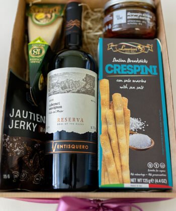A box with red wine and delicious snacks