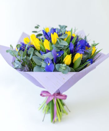 Bouquet of yellow tulips and blue irises