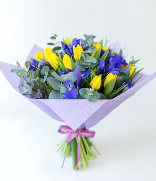 Bouquet of yellow tulips and blue irises