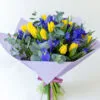 Bouquet of yellow tulips and blue irises